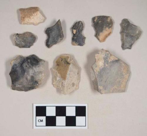 Chipped stone, flint flakes, possibly notched, one with cortex; chipped stone, flint blades, notched or serrated, some with cortex; chipped stone, flint spokeshaves, one with cortex