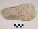 Ground stone object, possible axe or hoe