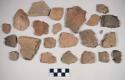 Coarse red bodied earthenware body sherds, some burnished, some with reduced core, some with blackened interior, some possibly slipped, some cord impressed, some crossmended with glue; coarse red bodied earthenware rim sherds, some with reduced core, some burnished, some with blackened interior; chipped stone, unifacially worked flake, ovate