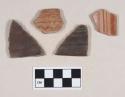 Red-on-Natural Painted Ware, body and rim sherds; two sherds darker due to burning