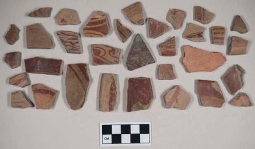 Red-on-Natural Painted Ware body and rim sherds; one possible Trade Ware with orange-pink paste