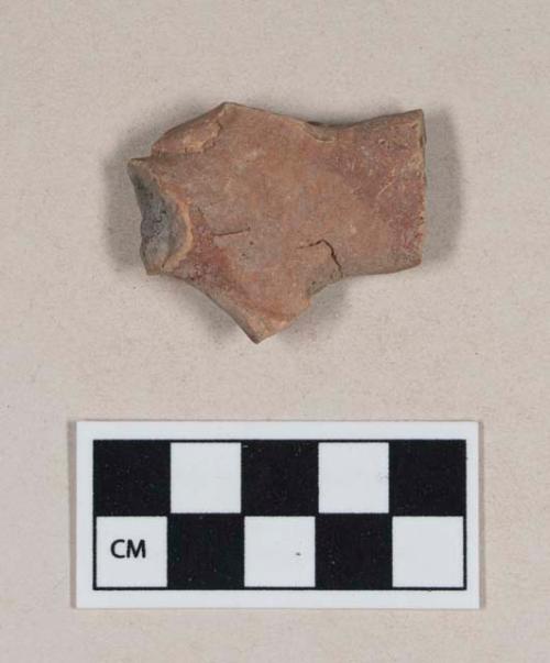 Red bodied earthenware figurine sherd, with red slipped decoration