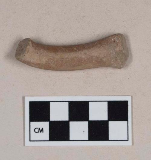 Red bodied earthenware figurine sherd, with red slipped decoration