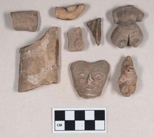 Red bodied earthenware figurine sherds, some human in appearance, some with red and white pigment