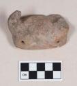 Red bodied earthenware figurine sherd, with pierced holes