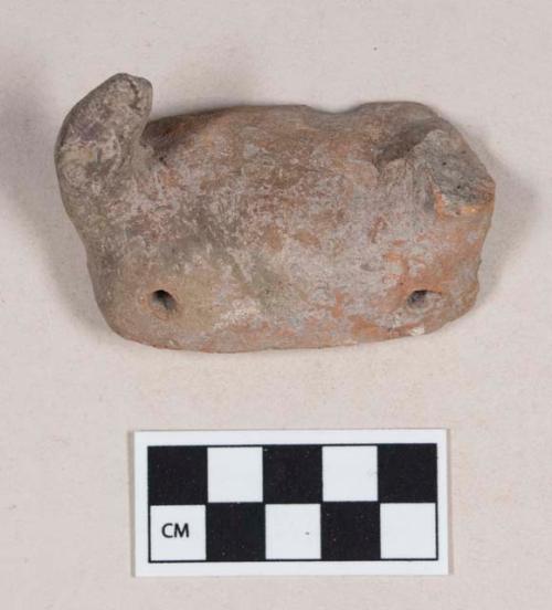 Red bodied earthenware figurine sherd, with pierced holes