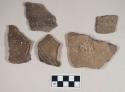 Coarse earthenware body and handle sherds, cord impressed, punctate, incised, shell temper