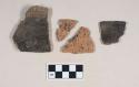 Coarse earthenware body and rim sherds, cord impressed, one with notched rim