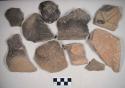 Coarse earthenware body, rim, and handle sherds, cord impressed, incised, punctate, rocker dentate, shell temper