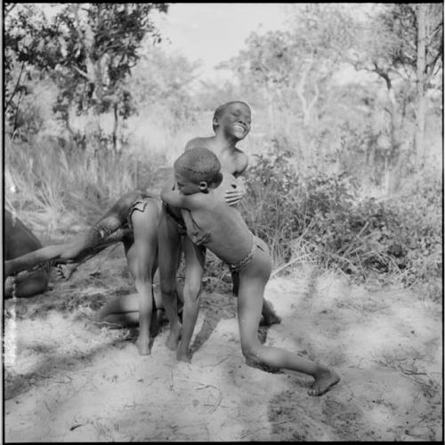 Four boys wrestling