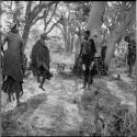 Group of women and girls playing khù n≠haru (skip-rope), with N!ai skipping, ≠Nisa and a girl swinging the rope