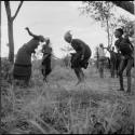 Group of women and girls playing khù n≠haru (skip-rope), with ≠Nisa skipping