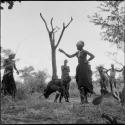 Group of women and girls playing khù n≠haru (skip-rope), with ≠Nisa and N!ai holding the rope