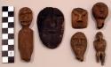 Wooden human effigies (one with bead inset eyes)