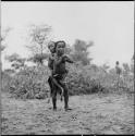 Two children playing piggy-back