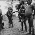 Group of children playing piggy-back