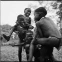 Group of boys playing piggy-back