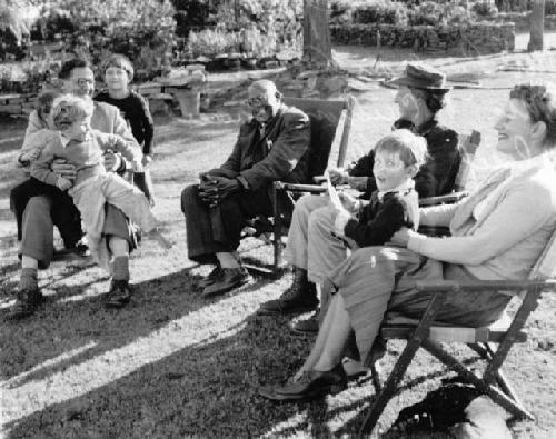 Group of people sitting, including P. Cardoss Grant and his wife, and Chief Sechele