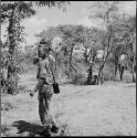 Three children standing near John Marshall with his film camera