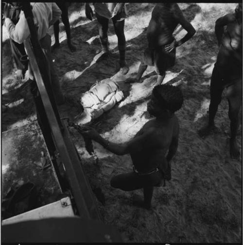 Group of men standing next to the expedition truck