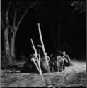 Group of women sitting, clapping for a night dance