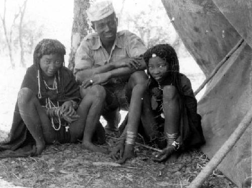 Shamba and Kahibi sitting with Joaõ, the interpreter