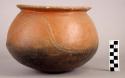 Restored red pottery vessel