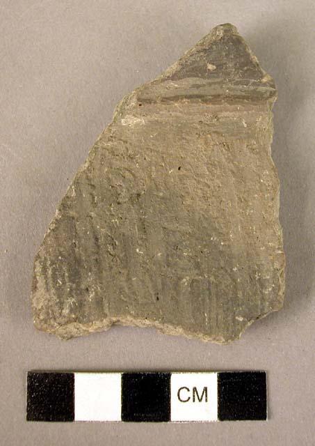 Fragment of pottery storage vessel with plain plastique ridge at base of rim-ban