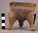 Pottery dish, tripod, legs hollow with clay balls