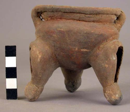 Pottery dish, tripod, legs hollow with clay balls