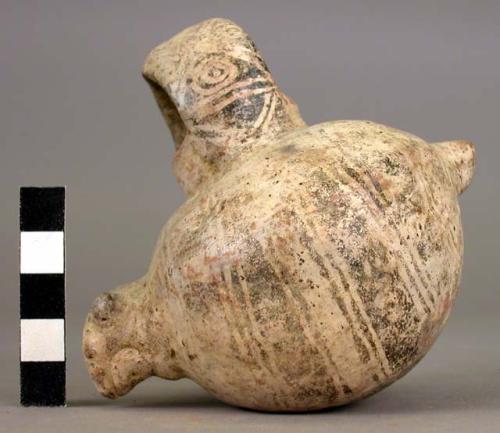 Polychrome pottery effigy bowl with handle