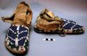 One pair of moccasins--skin with rawhide soles; top beaded