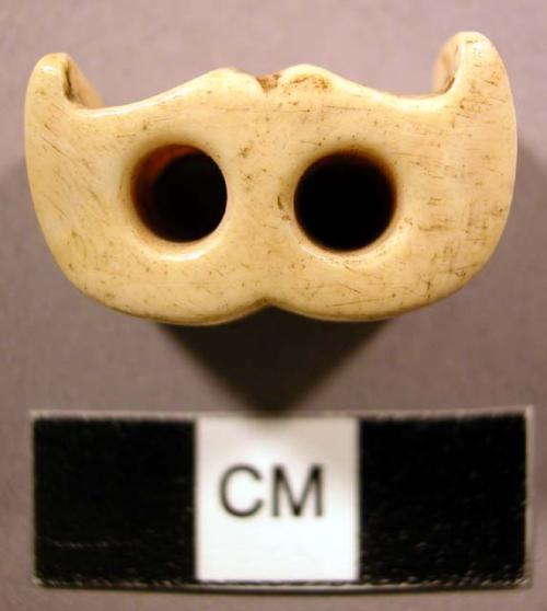 Toggle, ivory, carved resembling whale tail, 2 perforations