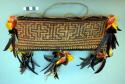 Basketry trinket box with cord and feathers