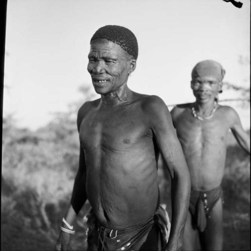 "/Gao Music" dancing behind another man in a daytime dance