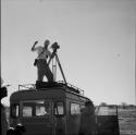 John Marshall filming from the top of the expedition Land Rover