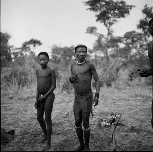 Man and a boy playing the "hitting game"