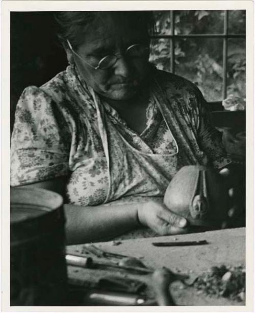 Maude Welch working on a pottery vessel