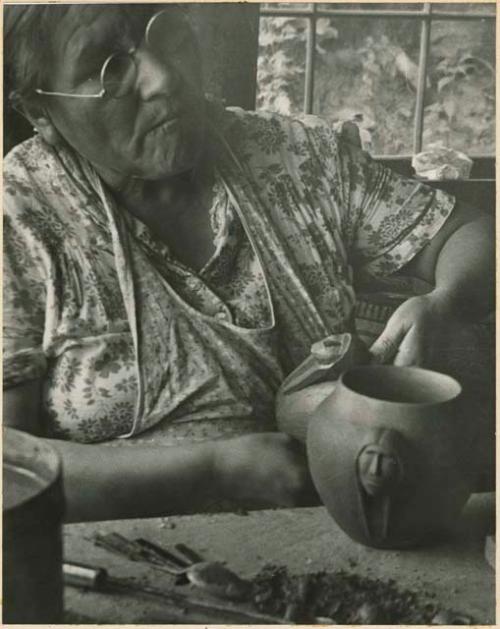 Maude Welch working on a pottery vessel