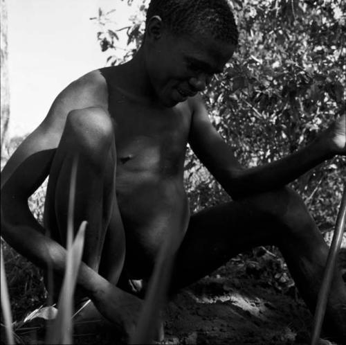 Man digging for roots, close-up