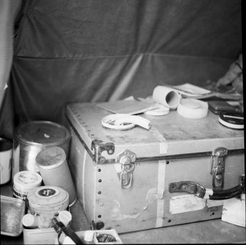 Equipment and a trunk inside an expedition tent