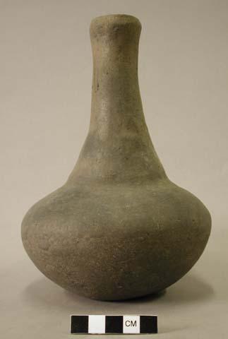 Ceramic vessel with long neck.