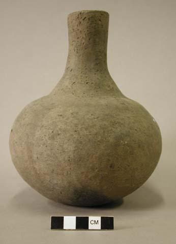 Ceramic vessel with long neck.