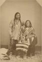 Studio portrait of Washington, Chief of an Ute tribe, with his son