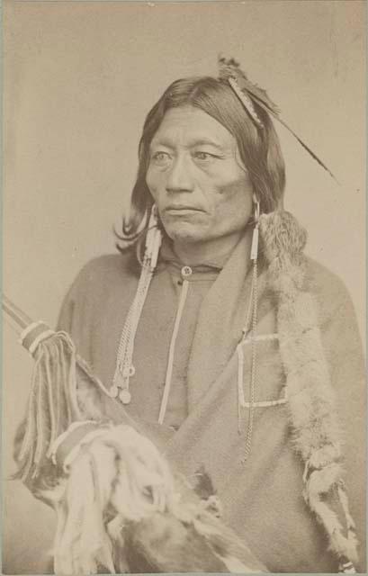 Studio portrait of Pacer, an Apache chief