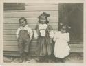 Three French Canadian/ Chippewa children posing for photograph