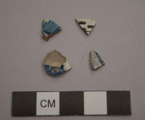 Earthenware, refined, mochaware-type; assorted sherds, three hand painted blue on white, two mochaware-type engine-turned