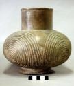 Ceramic complete vessel, neck, burnished, incised spiral design, footed ring