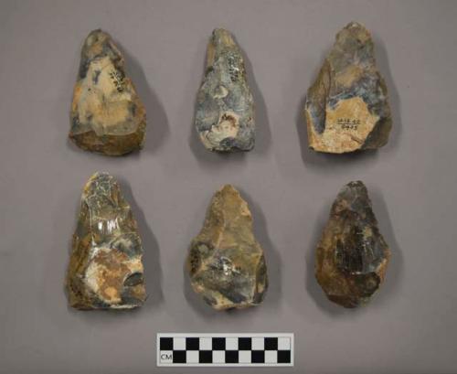 6 small pointed flint hand axes