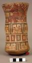 Vase painted in polychrome with mythical beings, faces, rectangles